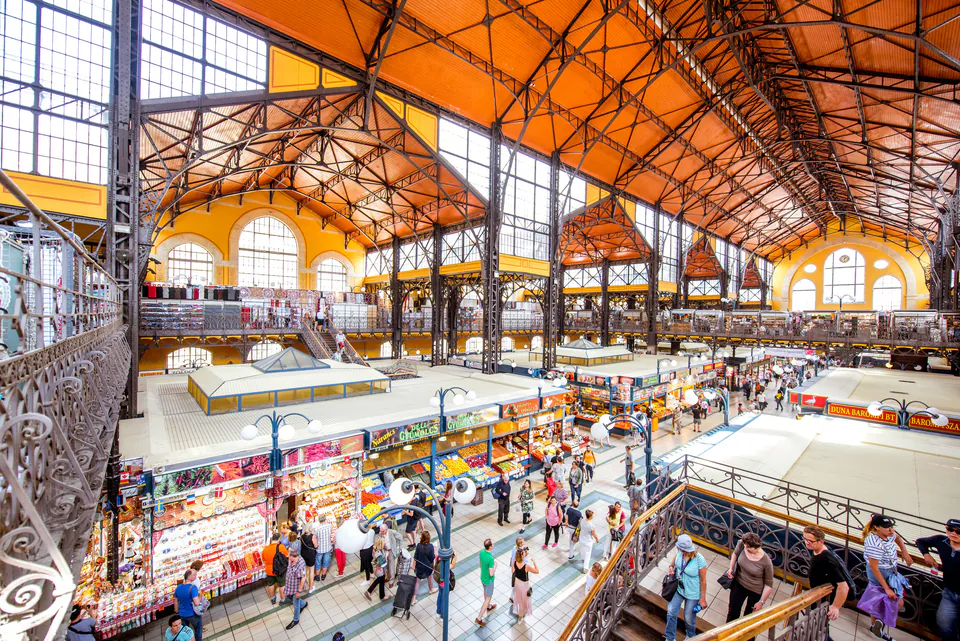 Interior view of Budapest's Great Market Hall showing its historic architecture and busy market stalls