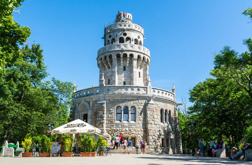 Historic stone observation tower with circular architecture and viewing platforms on János Hill