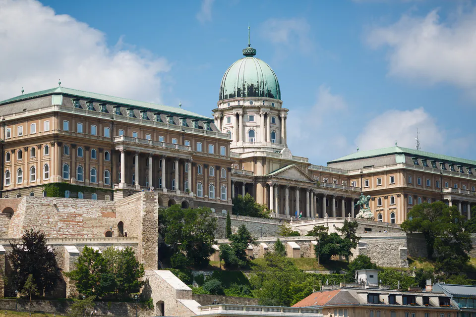 Buda Castle's Royal Palace with grand domed central structure and baroque wings atop Castle Hill