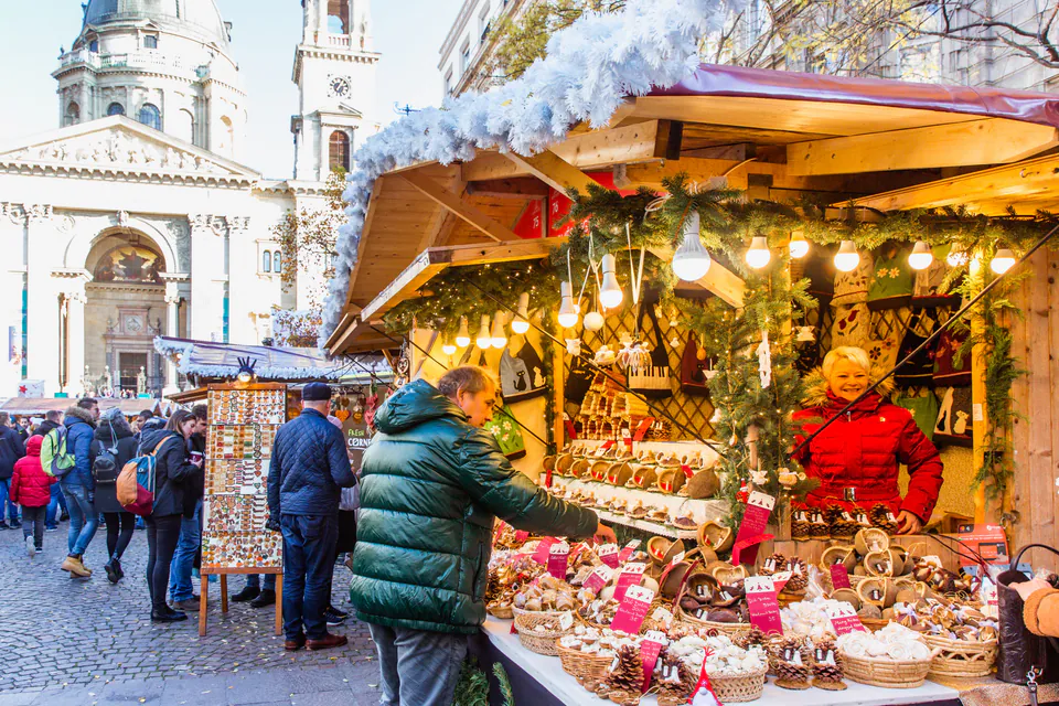 Festive market stall selling traditional Christmas treats and decorations outside St. Stephen's Basilica