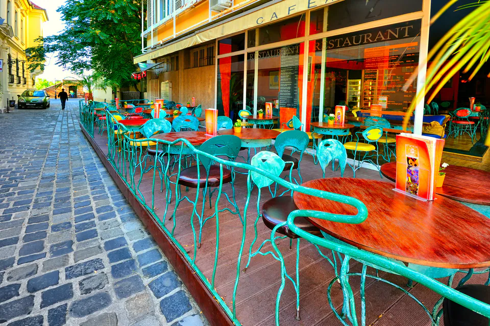 Local cafe in Budapest serving as Radical Storage partner location with luggage storage sign