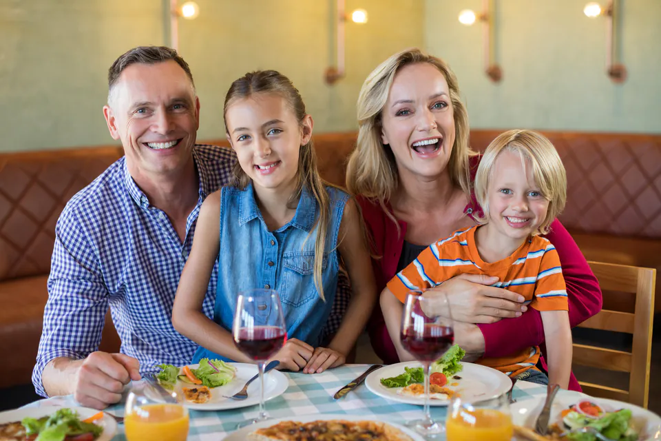 Family restaurant with children's play corner and parents dining nearby