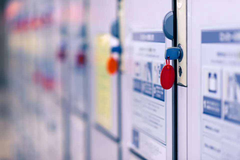 Close-up of secure storage lockers with numbered doors and key locks