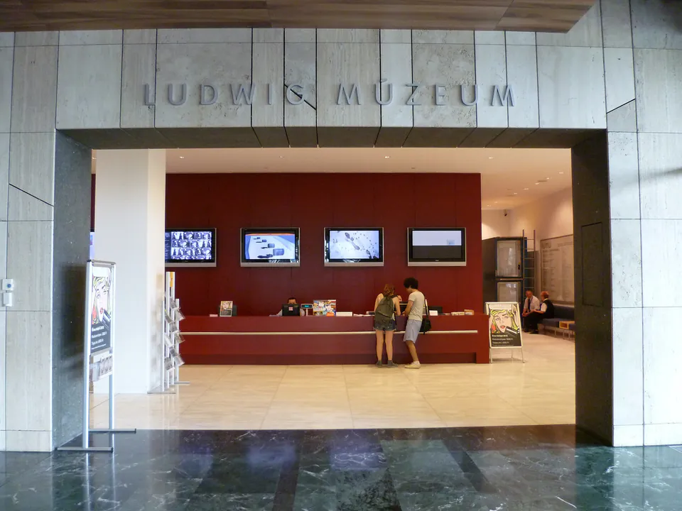 Modern reception area of Ludwig Museum with digital displays and marble entrance