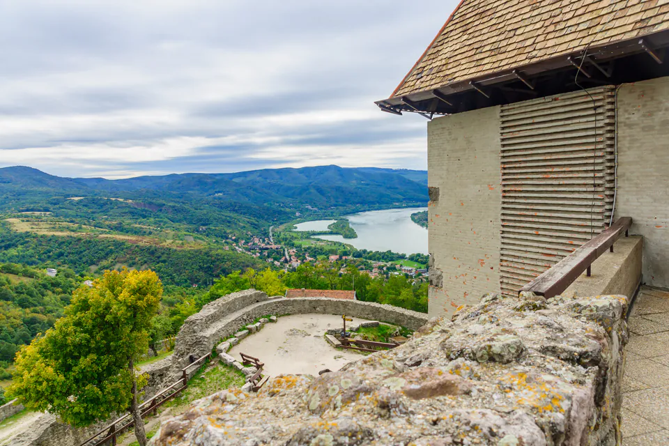 View from Visegrád Citadel showing stone fortress wall, courtyard and Danube River bend below