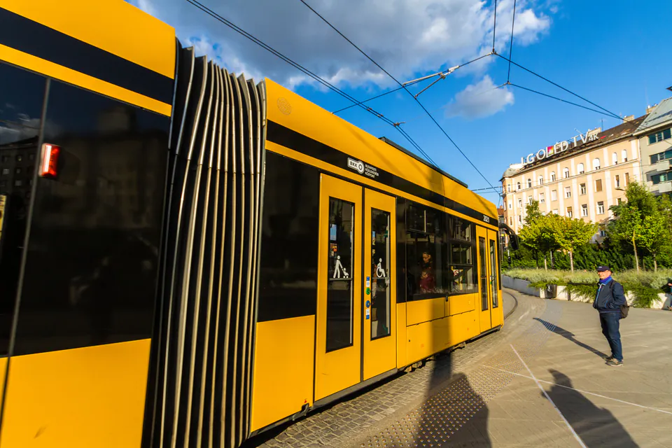Accessible low-floor tram with wheelchair symbol and ramp access