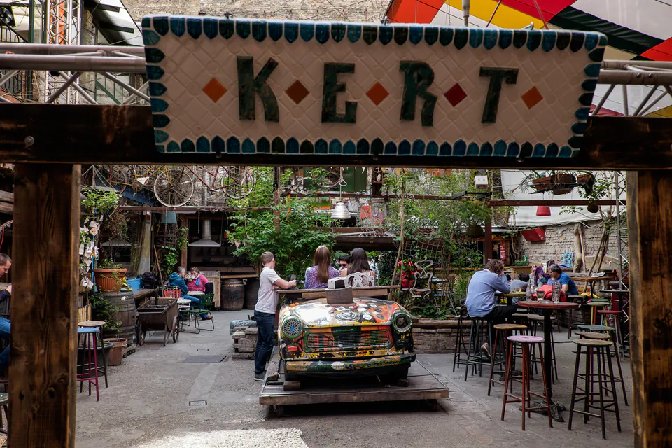 Interior of Szimpla Kert ruin bar with eclectic decorations