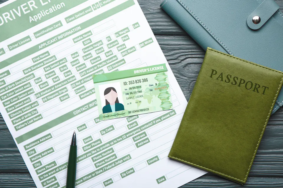 International driving permit and passport on car rental desk