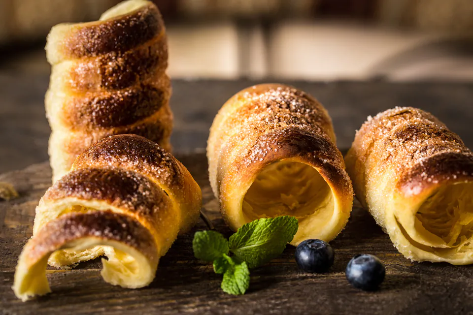Traditional Hungarian pastries beautifully displayed with mint leaves and blueberries