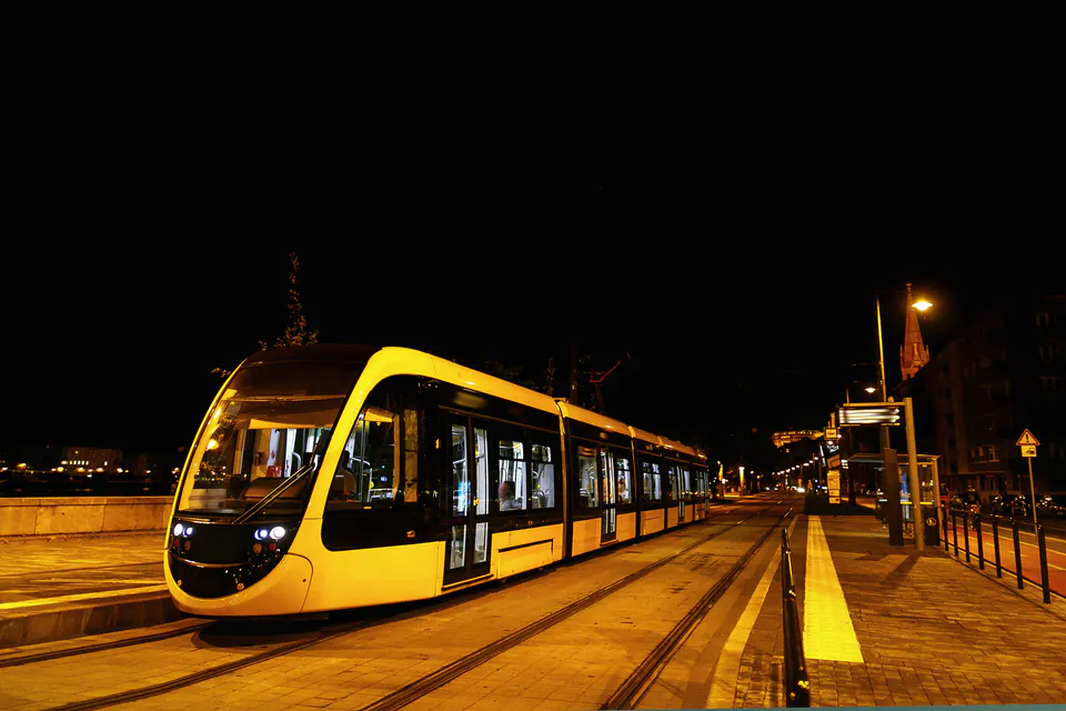 Budapest tram stop at night with good lighting and safety features