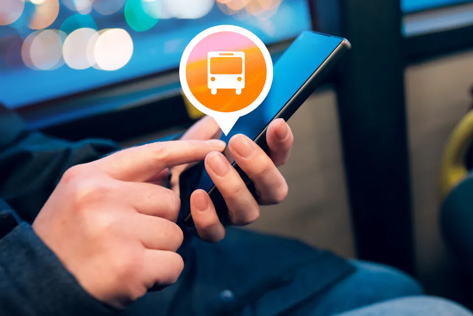 Smartphone displaying transportation app with orange bus icon location marker