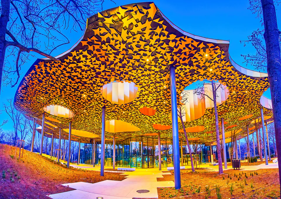 Modern facade of the House of Hungarian Music in City Park with its unique perforated roof design
