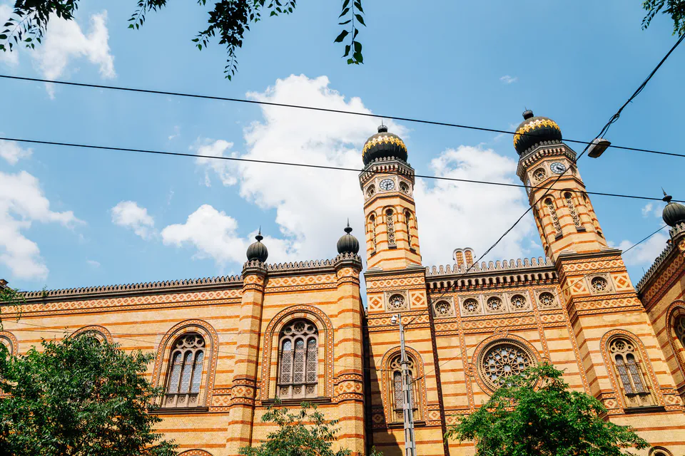 Ornate Moorish-style facade of Dohány Street Synagogue with twin golden-domed towers
