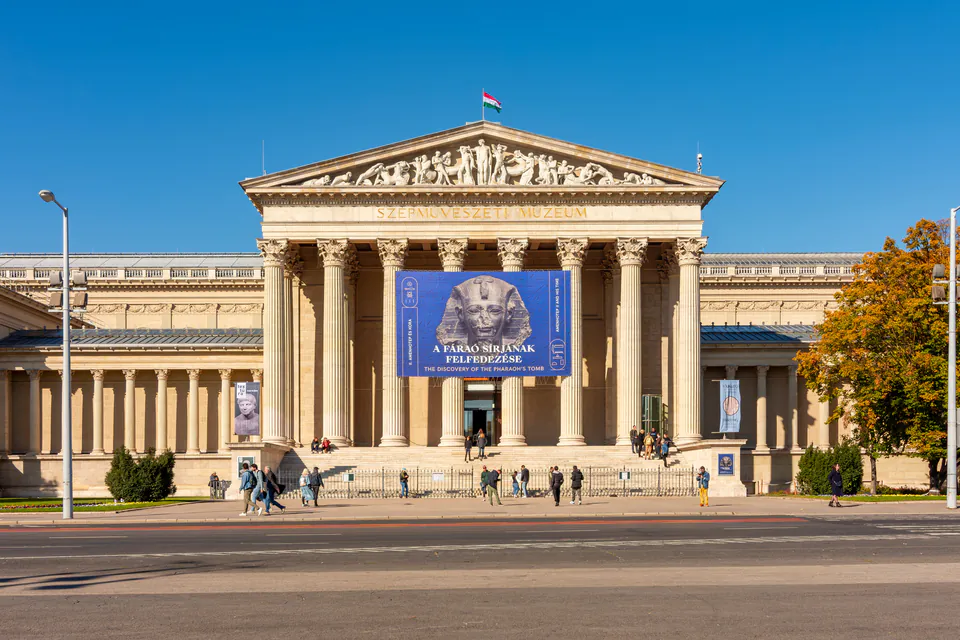 Museum entrance with classical columns and Egyptian exhibition banner