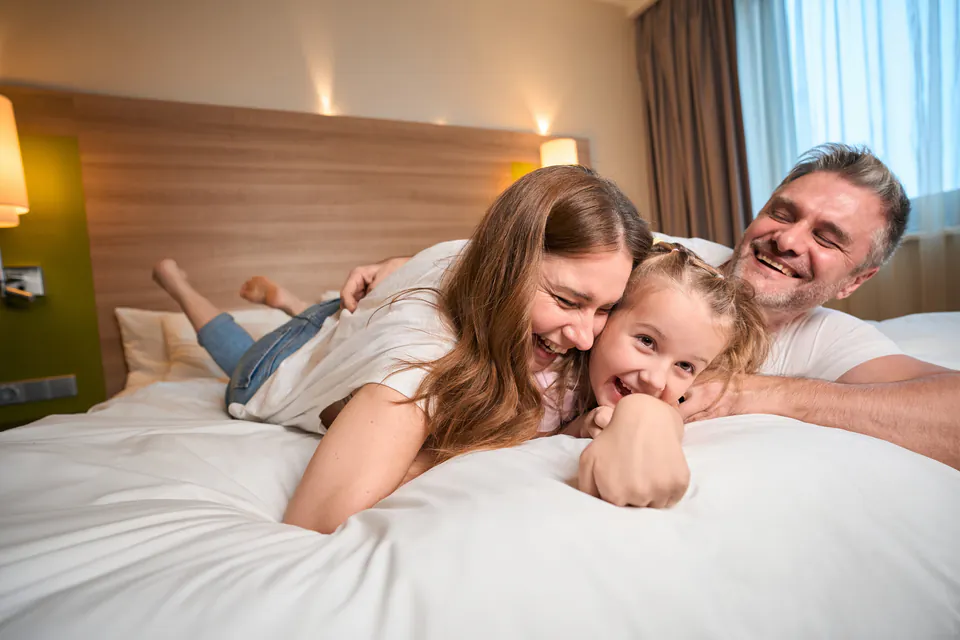 Family hotel room with cots and child-friendly amenities in Budapest