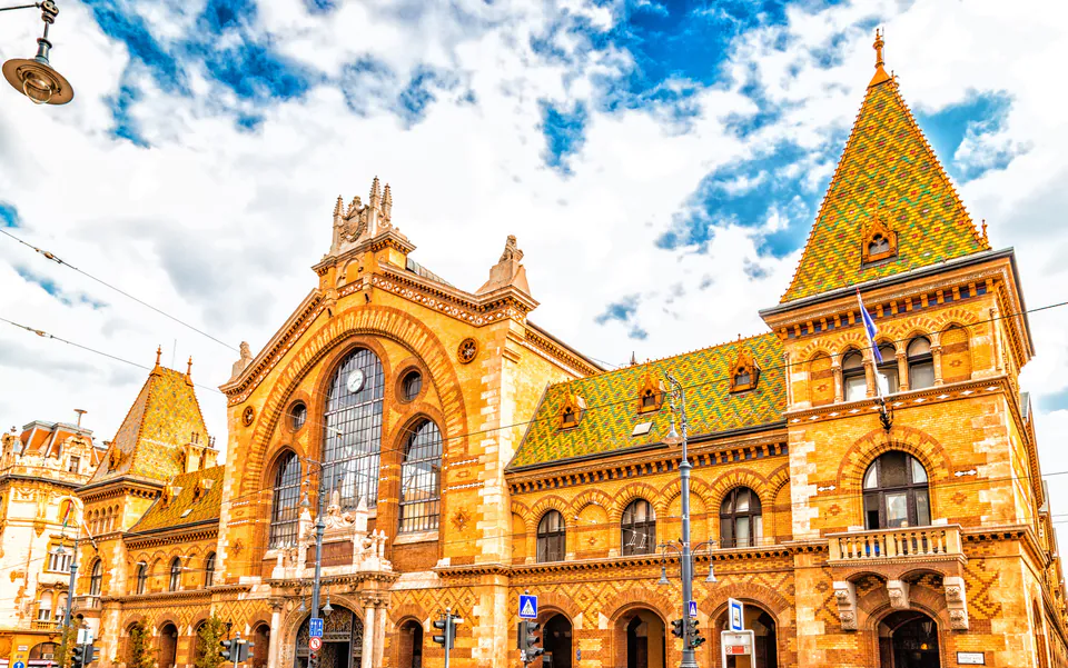 Historic Great Market Hall building exterior with ornate neo-Gothic architecture and colorful tiled roof