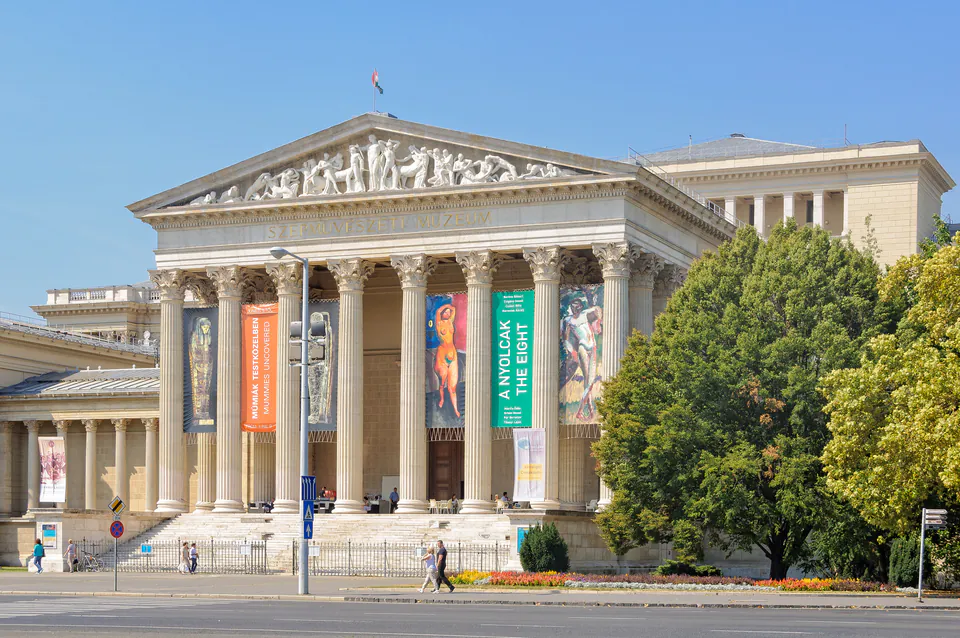 Neoclassical facade of Budapest Museum of Fine Arts with columns and exhibition banners