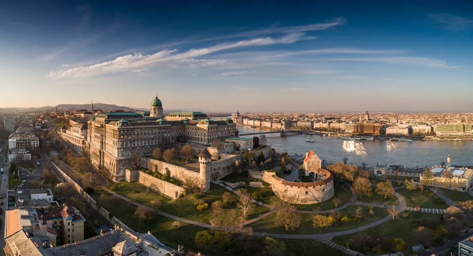 Medieval cobblestone street in Buda Castle District with Gothic architecture and historic lampposts