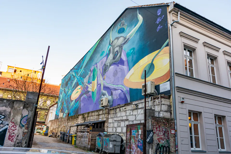 Colorful street art mural on building wall in Budapest's Jewish Quarter