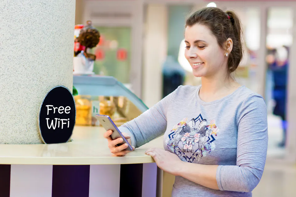 Tourist using public WiFi at a Budapest café