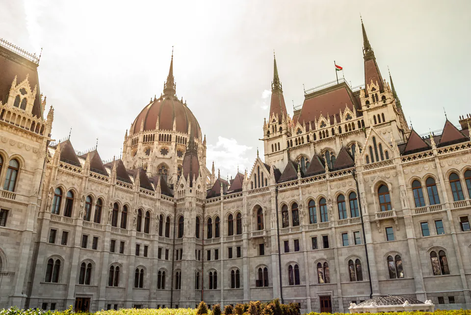 Hungarian Parliament Building's ornate neo-Gothic facade and central dome in afternoon light