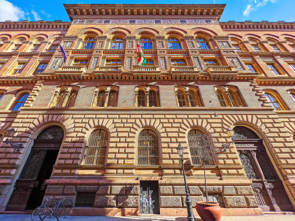 Neo-Renaissance building facade with ornate stonework, arched windows and decorative cornices