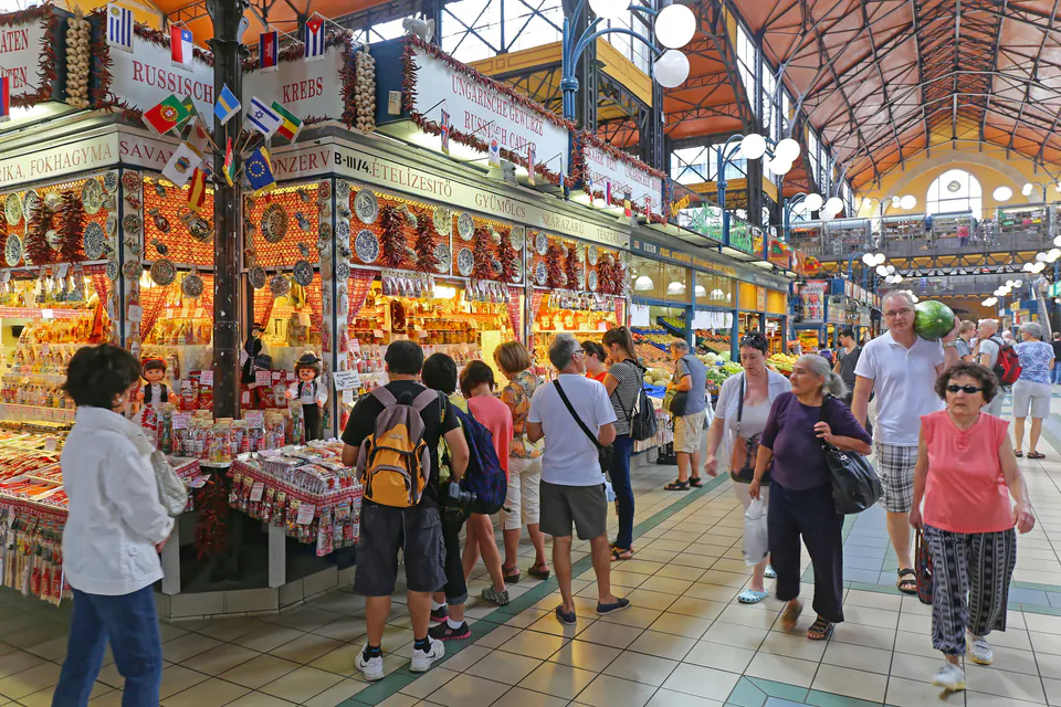 Traditional Hungarian market hall with vendors selling local produce and crafts