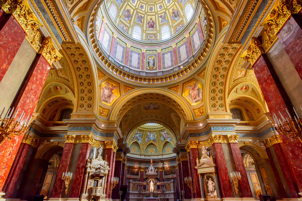 St. Stephen's Basilica interior showing ornate altar and dome with golden light