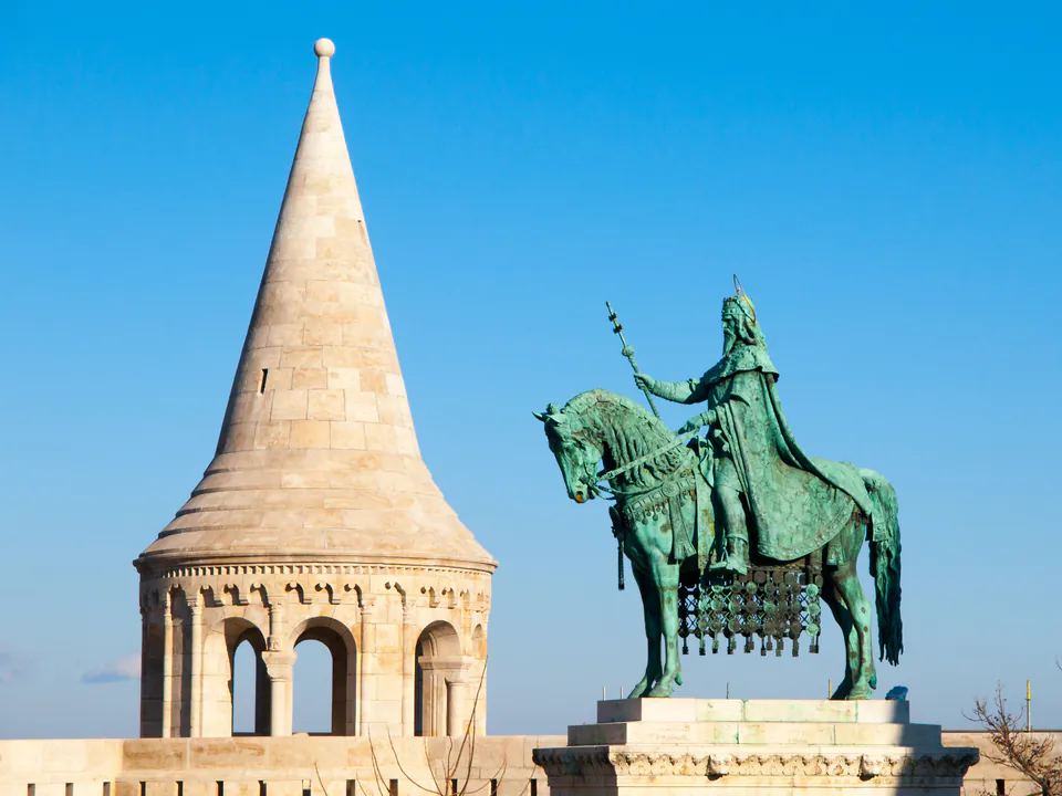 Bronze equestrian statue beside neo-Romanesque tower at Fisherman's Bastion