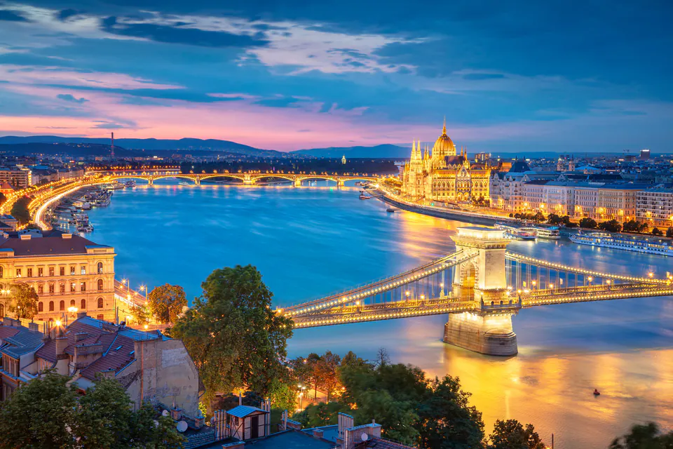 Evening panorama of illuminated Budapest with Chain Bridge, Parliament and Danube River