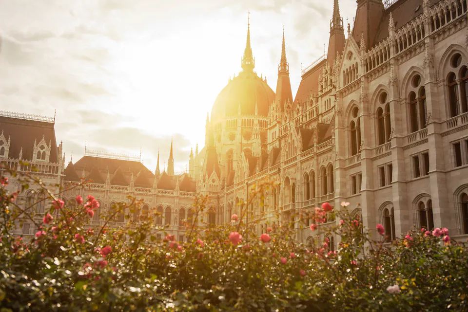 Budapest skyline at sunset with Parliament building reflected in Danube River