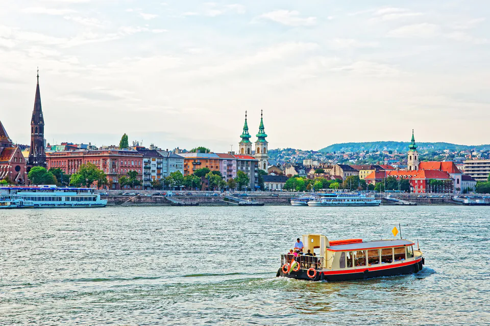 Public ferry boat crossing the Danube River in Budapest