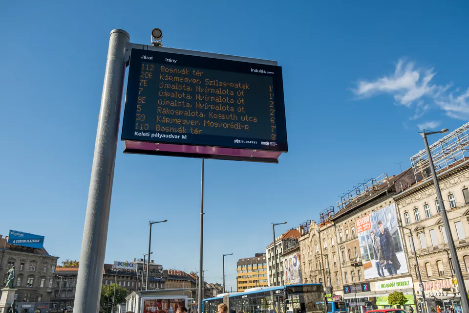 Budapest bus stop with digital display showing arrival times and route information