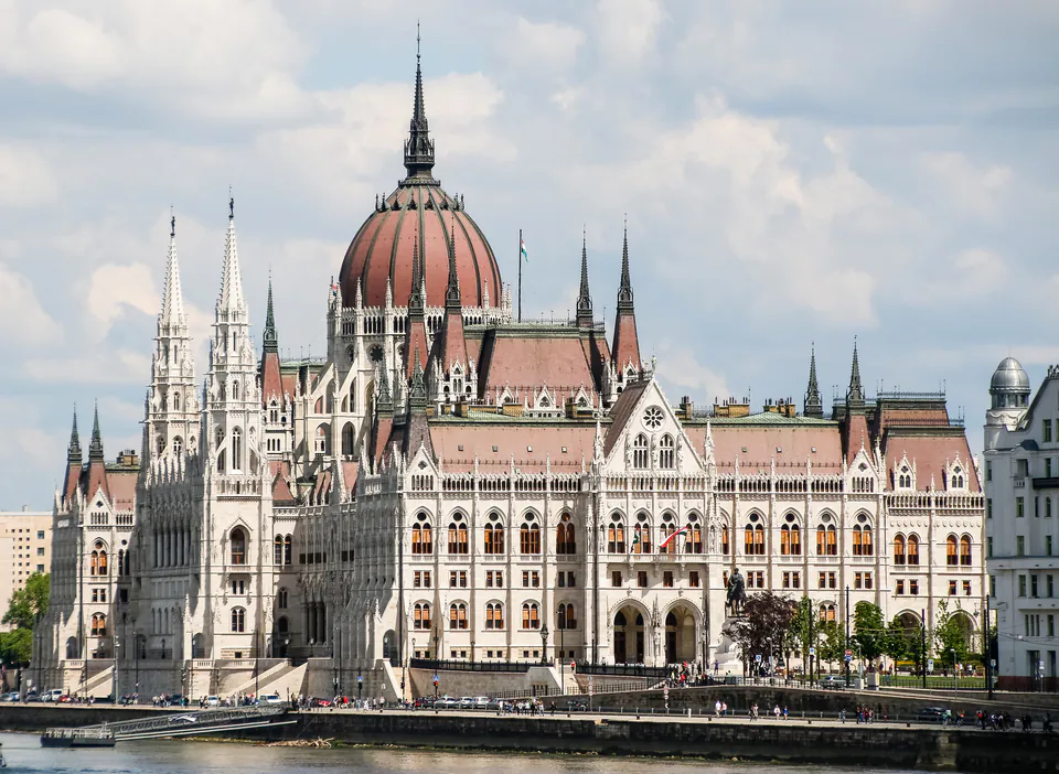 Hungarian Parliament Building with its iconic neo-Gothic architecture and pink dome along the Danube