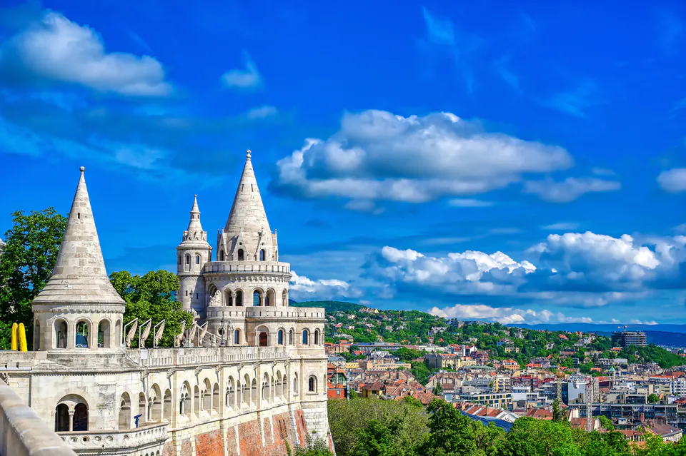 Fisherman's Bastion towers overlooking Parliament building and Danube River