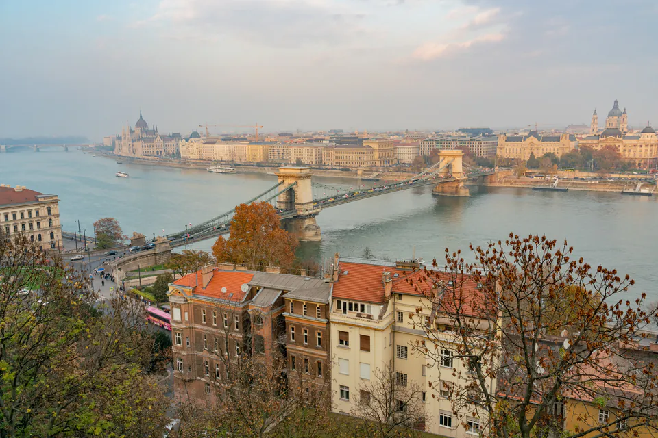 Luxury hotel room with panoramic windows overlooking Danube River and Buda Castle