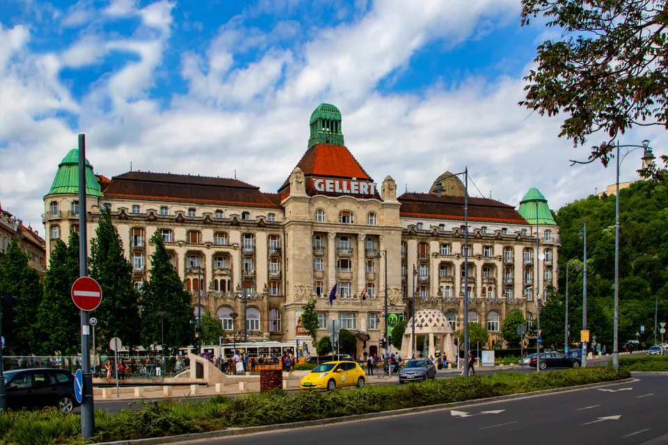 Historic Gellért Hotel exterior with ornate Art Nouveau architecture and green domed towers