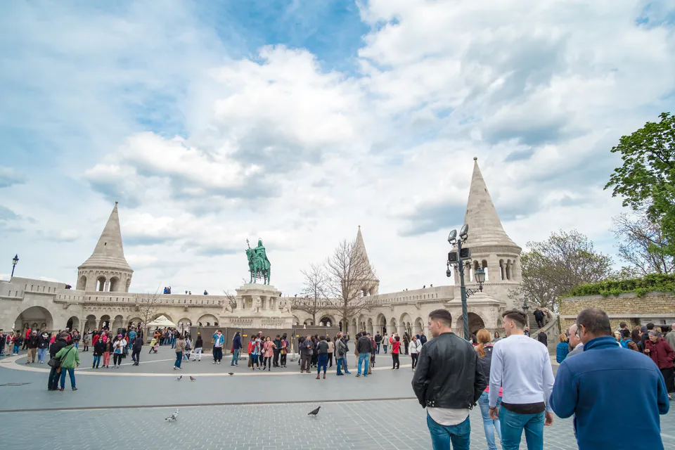 Tour group gathering at Fisherman's Bastion terrace with its iconic white towers and arches
