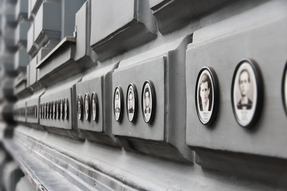 The Perpetrators' Wall at House of Terror with circular portraits of regime members