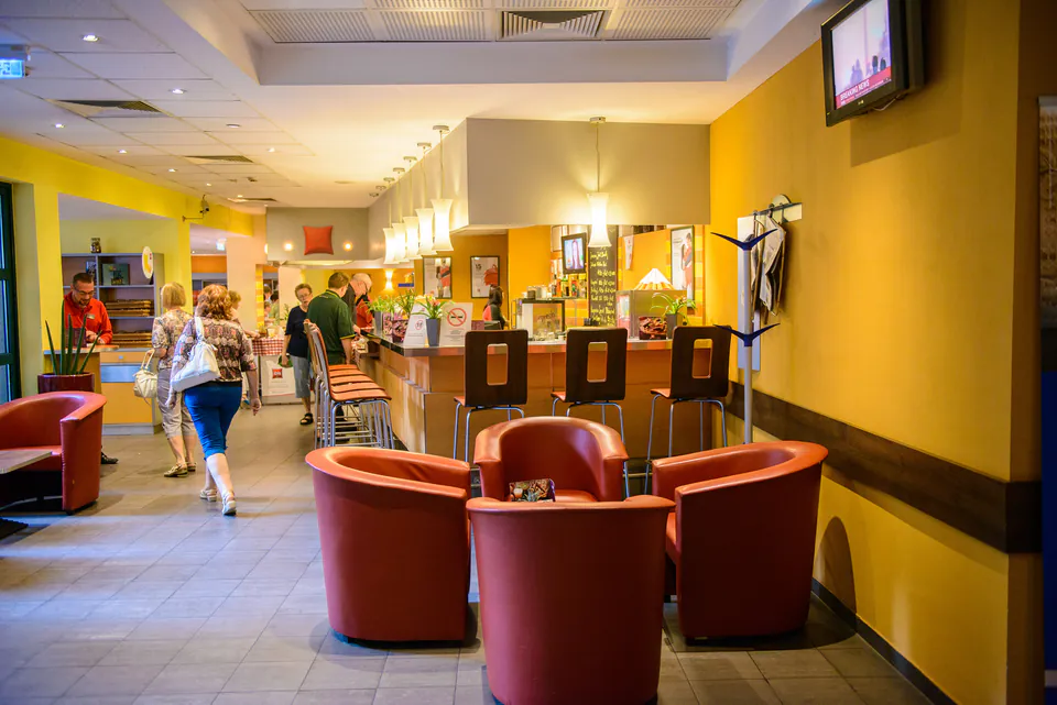Common area in a Budapest hostel with travelers socializing