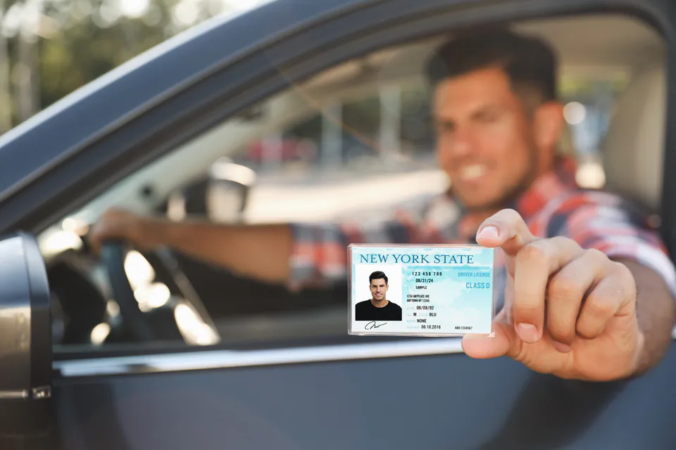 International driving permit and passport documents on car rental desk