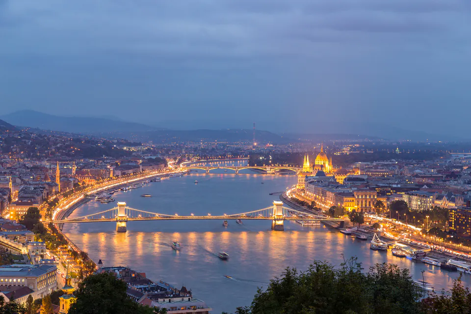 Panoramic view of Budapest showing Buda Castle on hills and Pest's flat landscape across Danube River