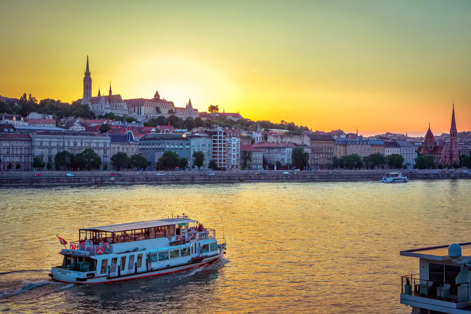Summer evening along the Danube with illuminated Chain Bridge and Parliament