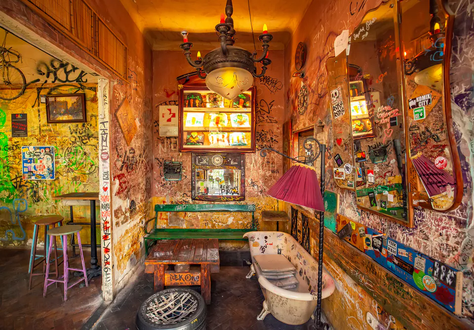 Eclectic interior of Szimpla Kert ruin bar with mismatched furniture and quirky decorations