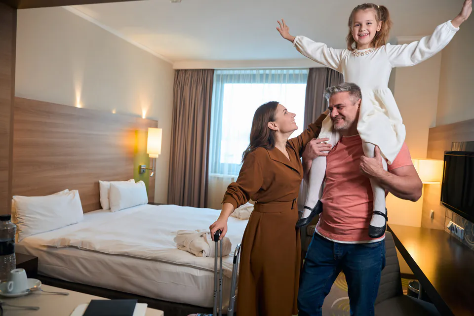 Modern hotel room interior with spacious sleeping area and room for families
