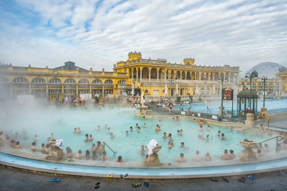 Széchenyi thermal baths outdoor pools with steam rising and chess players